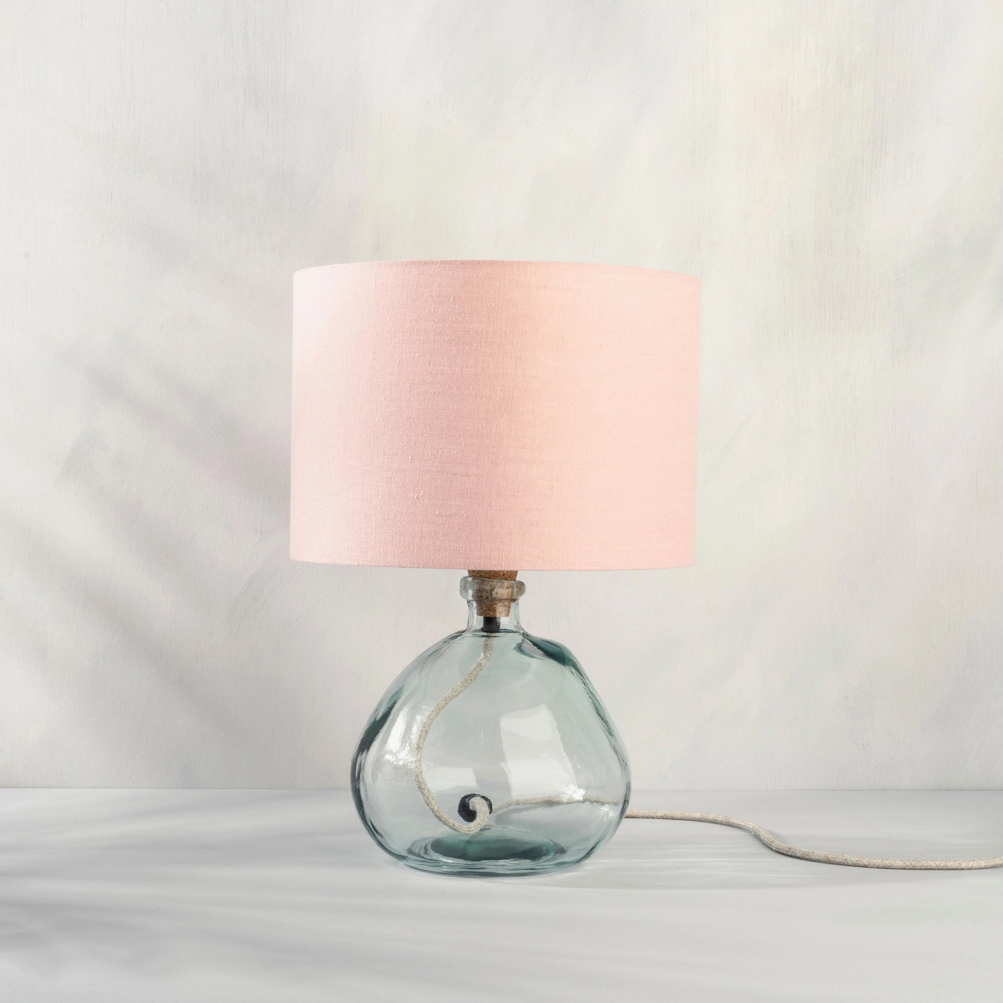 Blush pink table lamp on recycled glass base