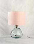 Blush pink table lamp on recycled glass base