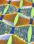 Lime Green, Orange and Blue Eyes Fabric